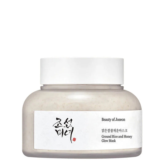 Pot du masque visage Beauty of Joseon Ground Rice and Honey Glow Mask. Design épuré avec étiquette blanche, contenant un masque à base de riz moulu et de miel pour l'éclat du teint.