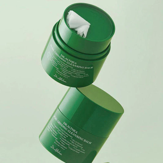 Deux pots de nettoyant baume visage coréen DR.ALTHEA  pure grinding cleansing balm, sur fond vert pastel épuré.