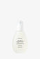 True Rose Repair Essence Urang Dans son flacon en verre sur fond blanc.