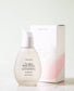 Urang True Rose Repair Essence dans son flacon en verre devant son packaging blanc et rose en carton