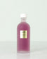 Urang Prestige Purple Essence Toner dans son flacon en verre sur fond blanc
